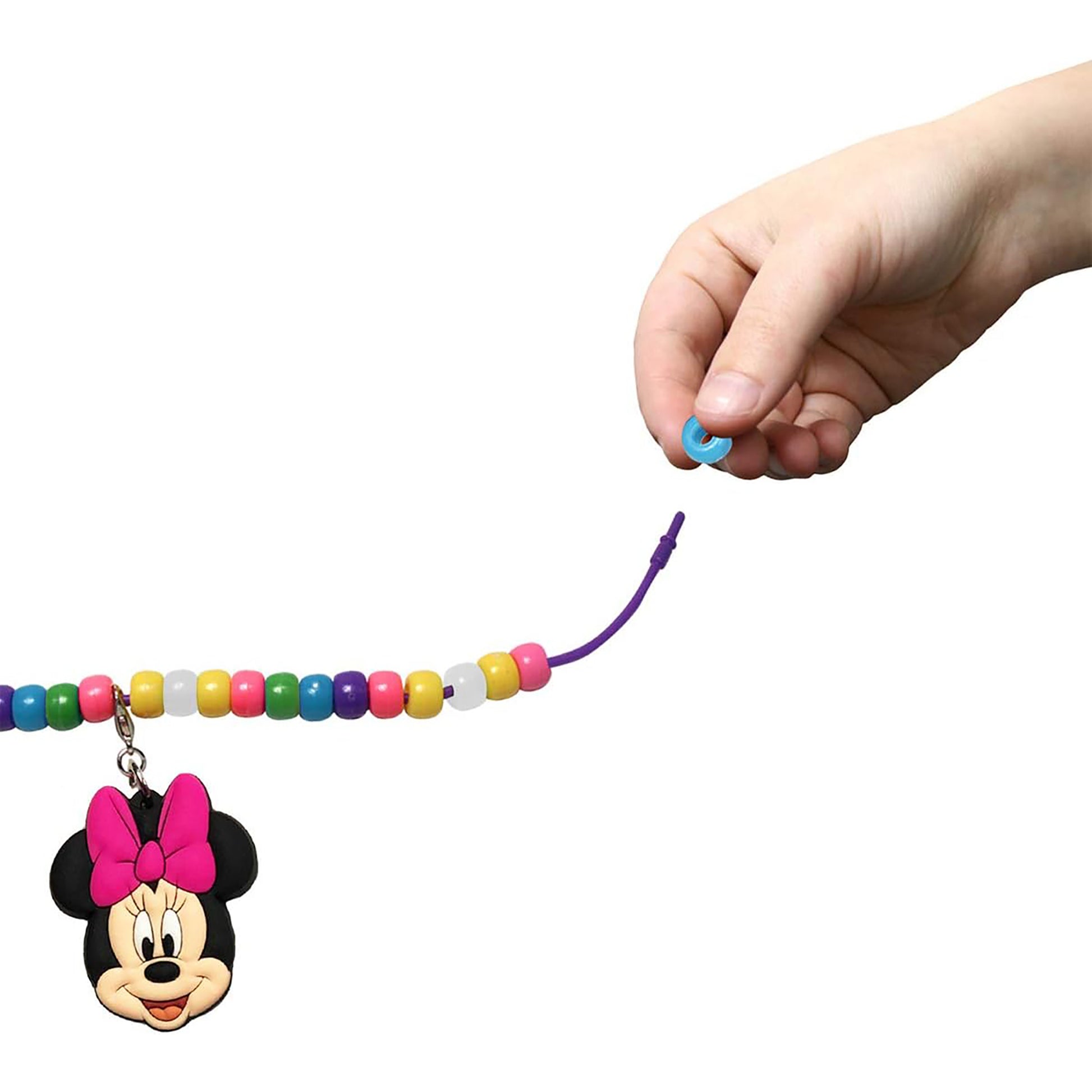 Minnie Mouse Necklace Activity Set with colorful beads and charm, held by child's hand