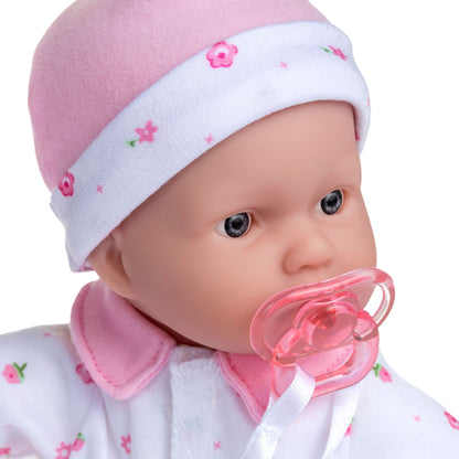 JC Toys La Baby 11 inch soft body doll with pink and white floral outfit, headband, and pacifier